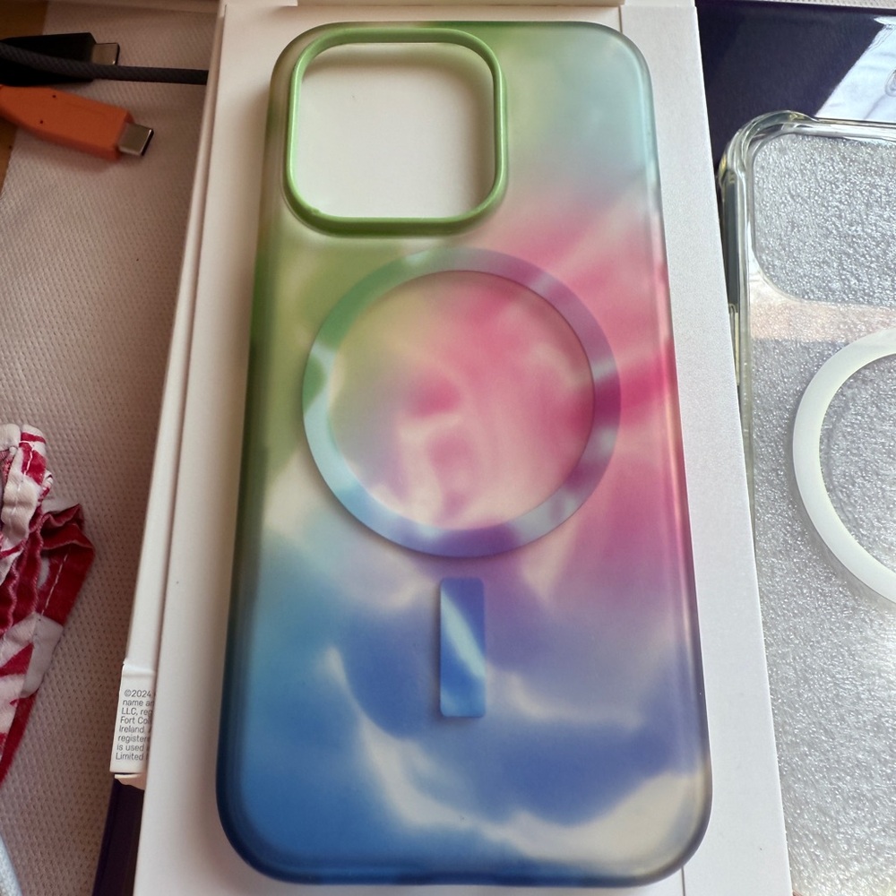 Multi-colored Otter MagSafe iPhone 15 Pro case.